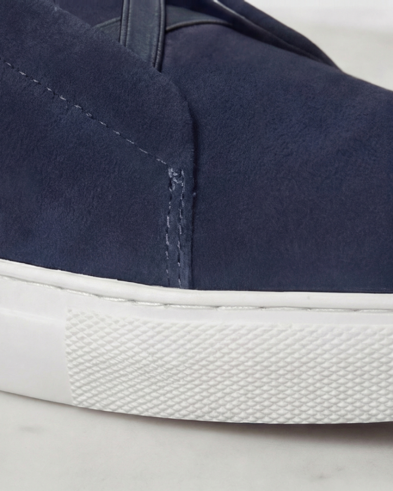 Close up men suede sneakers side stitching detail minimalist casual footwear