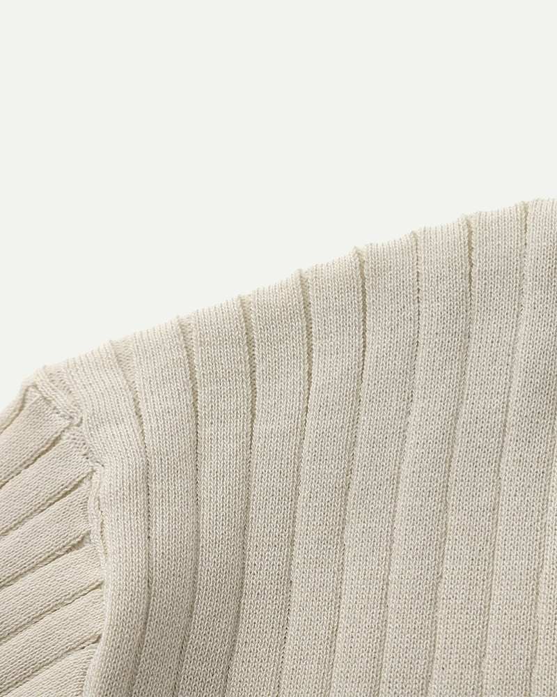 Close-up of a textured beige fabric with a white background