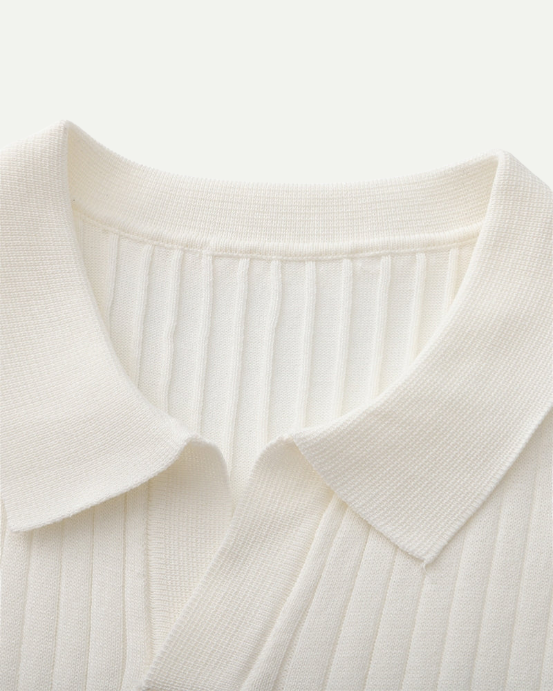Close-up of a white ribbed polo collar on a white background