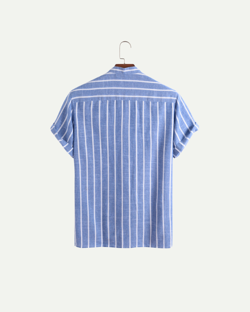 Blue and white striped linen polo shirt on a hanger against a white background