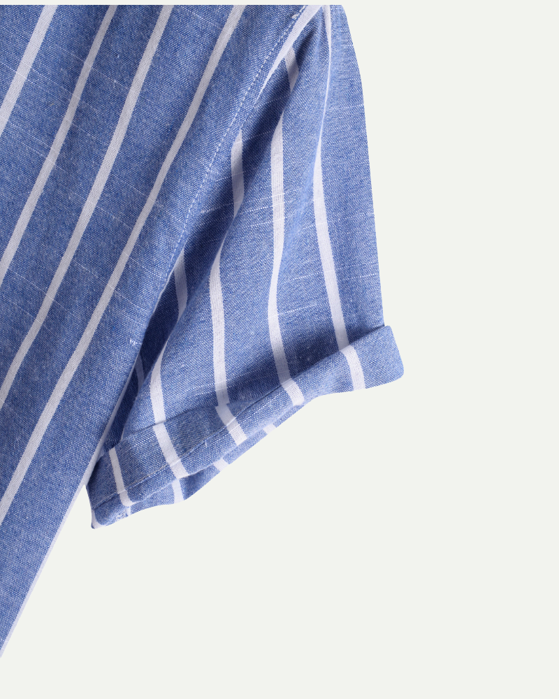 Blue and white striped fabric on a light gray background