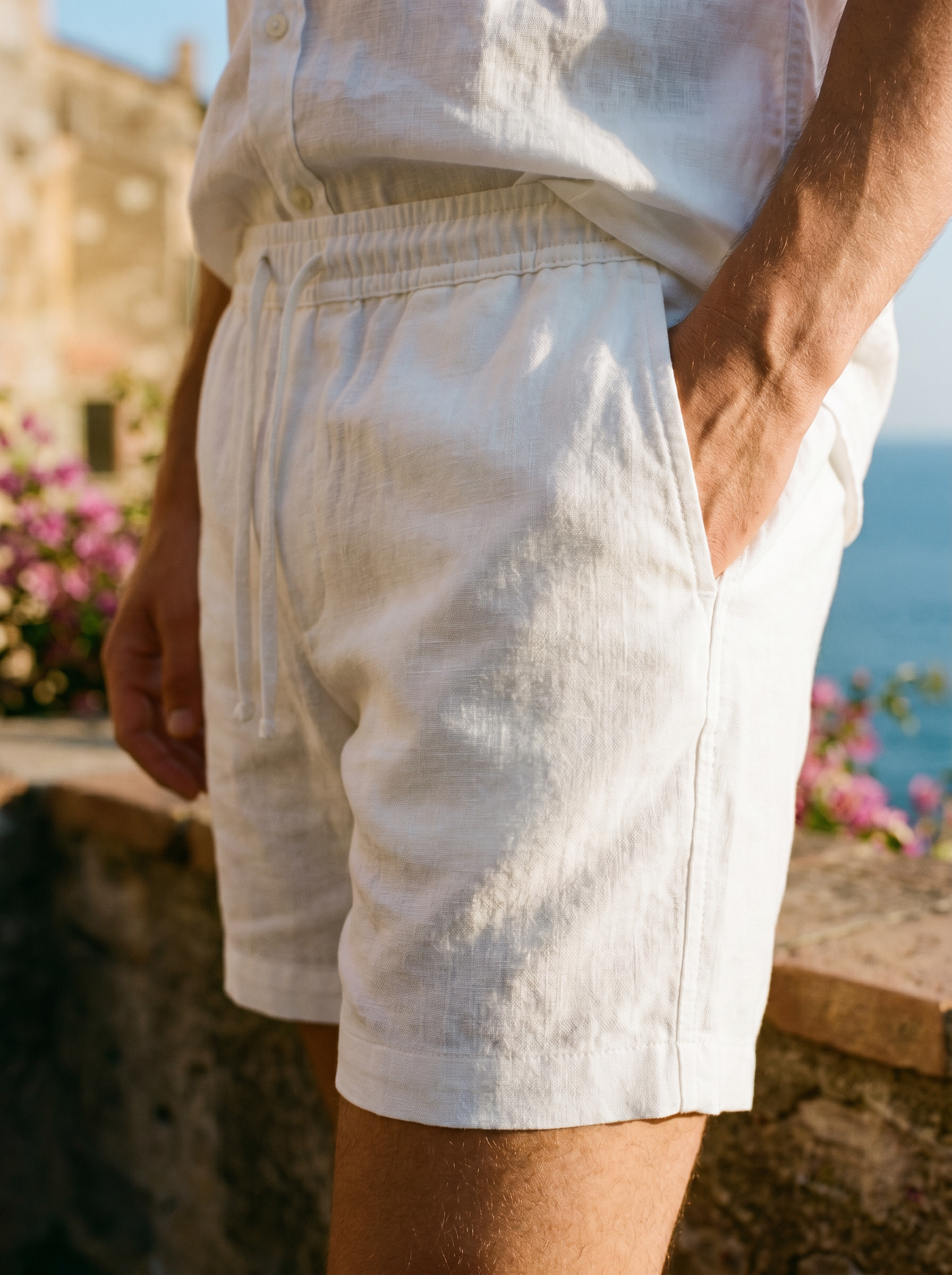 Men's white linen shorts fabric and fit detail — Aveloire Marlowe