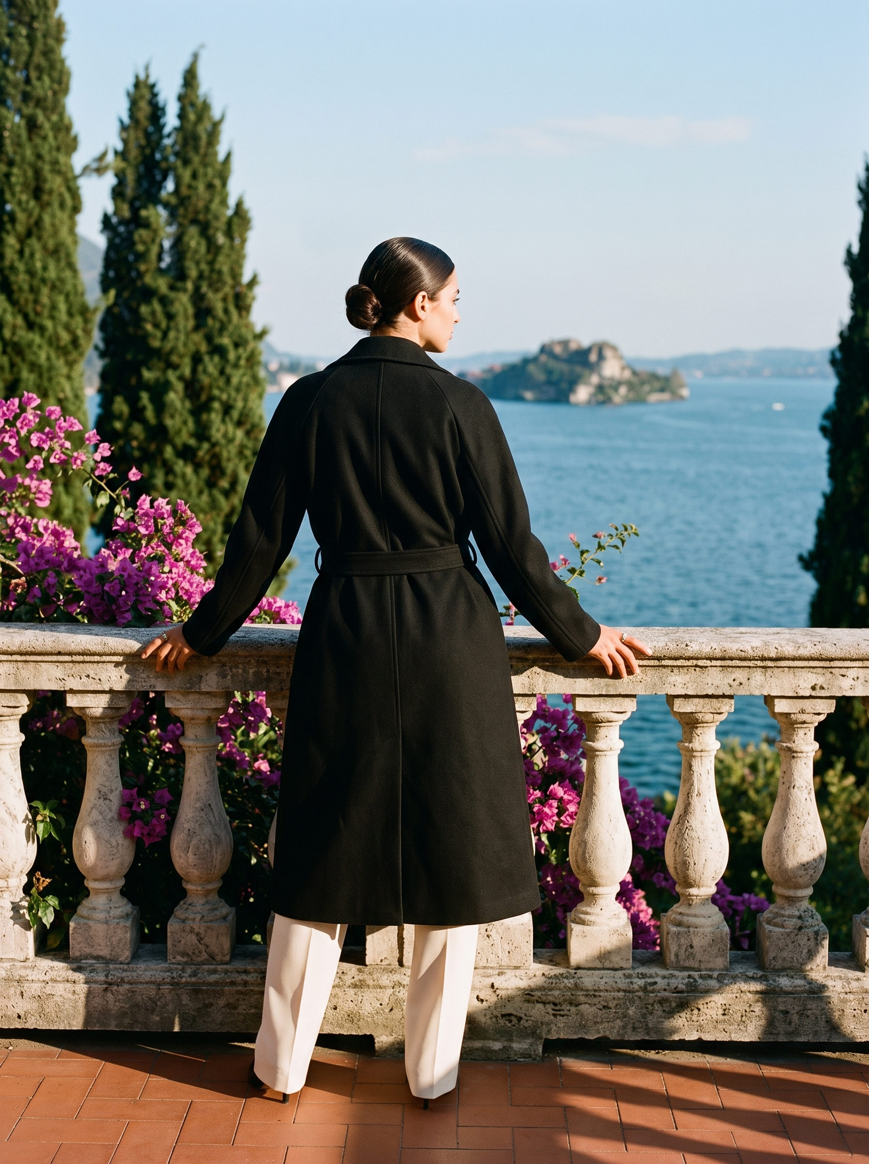 Black longline winter trench coat full body back view — Aveloire