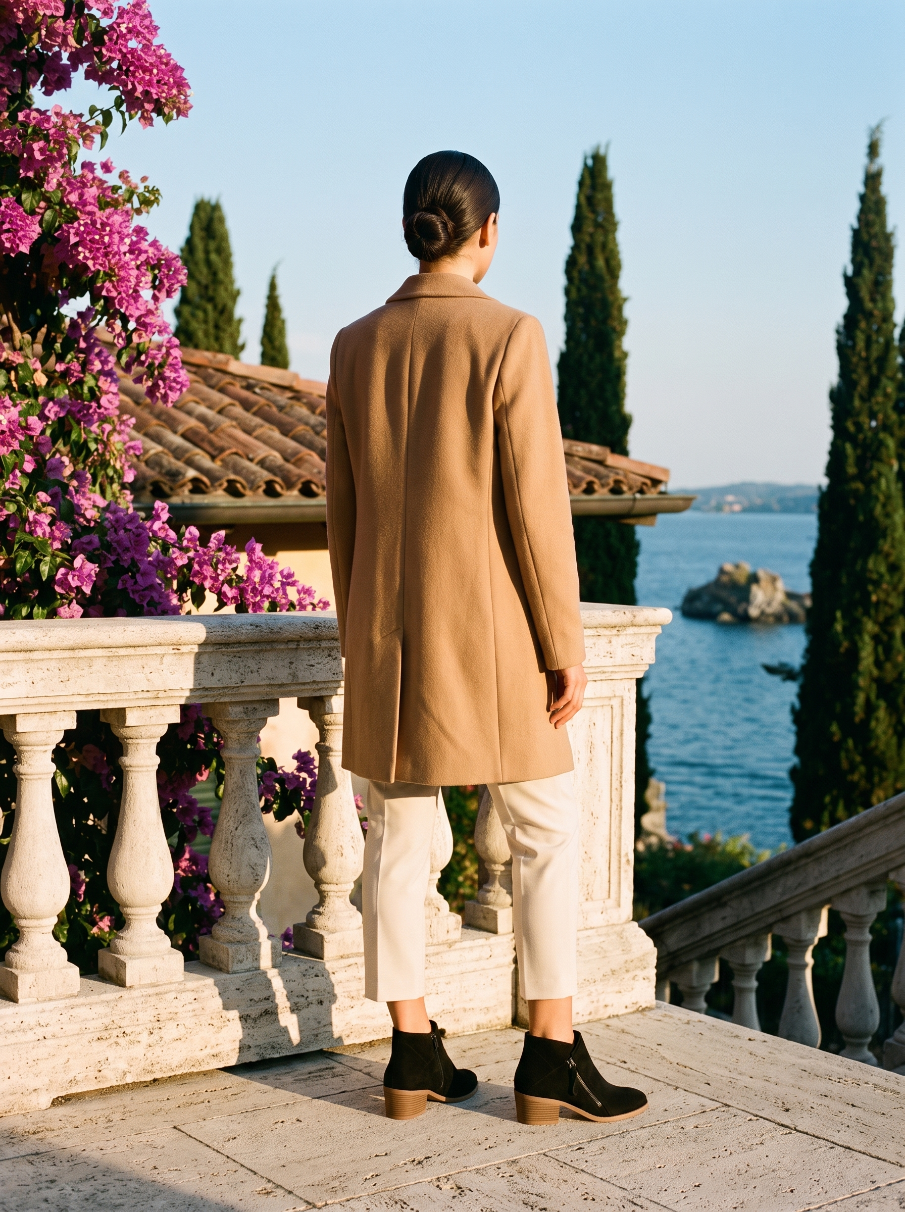 Back view of black suede side zip ankle boots at a Lake Como balustrade — Aveloire
