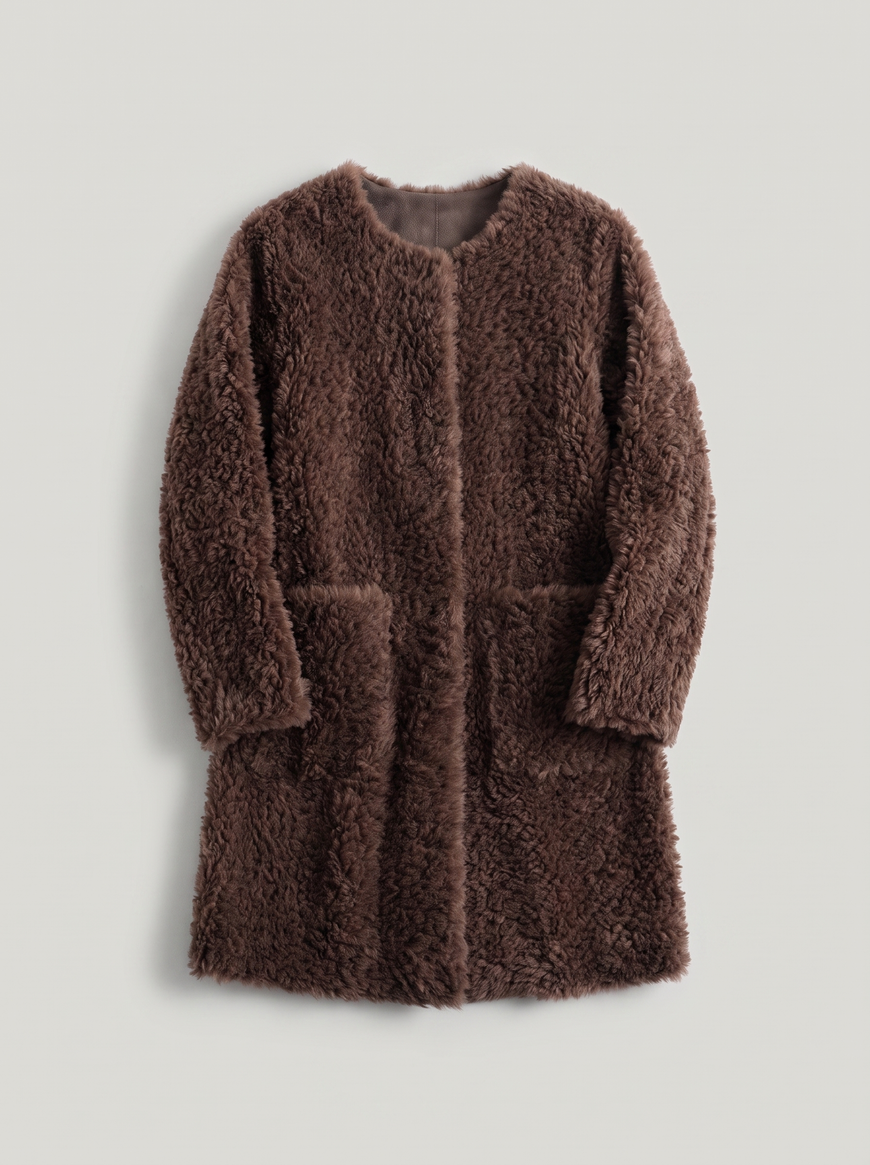 Coffee-brown shearling teddy coat flat lay product photo — Cecille by Aveloire