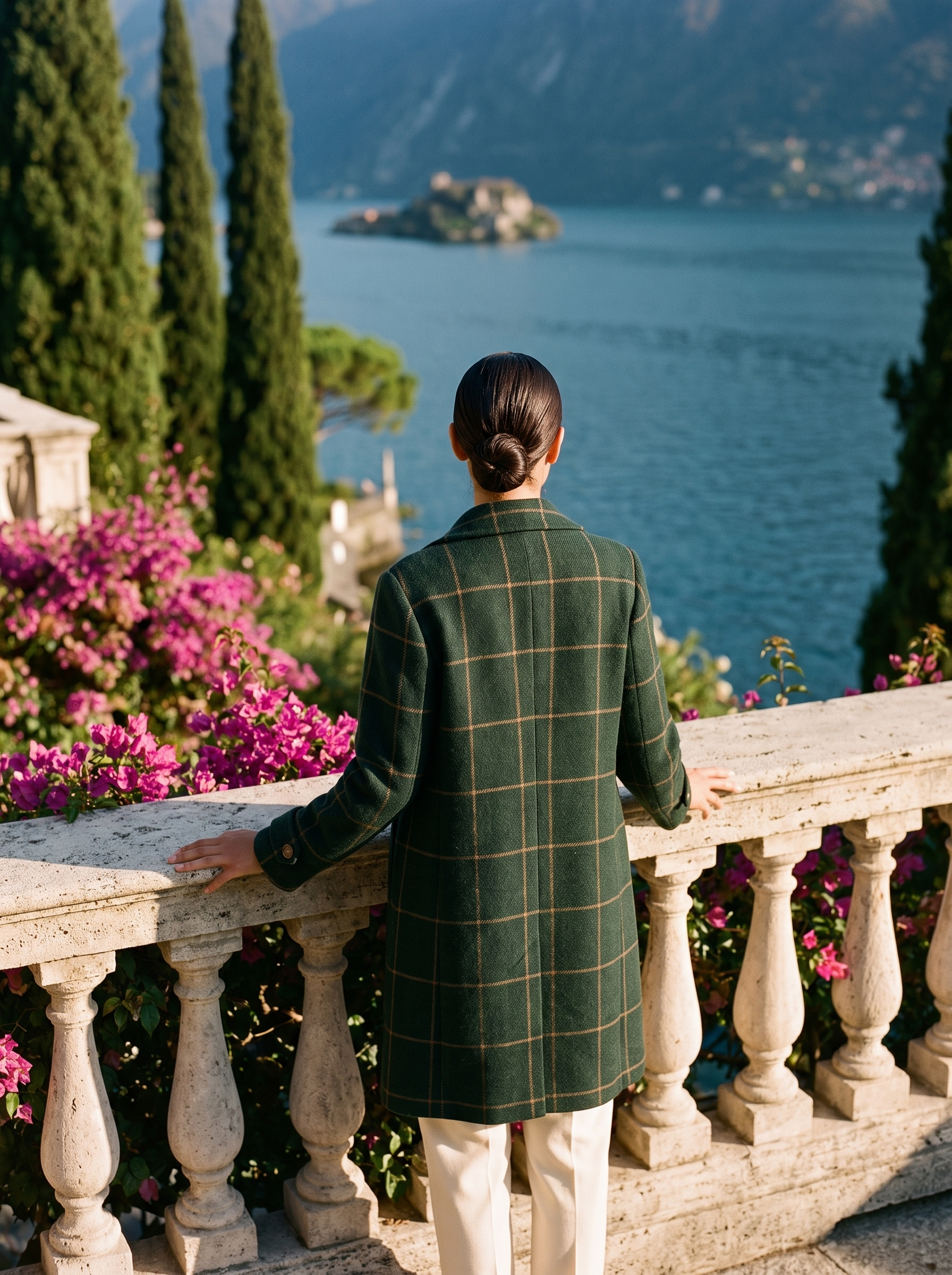 Back view of a green windowpane-check wool coat on a Lake Como terrace — Aveloire