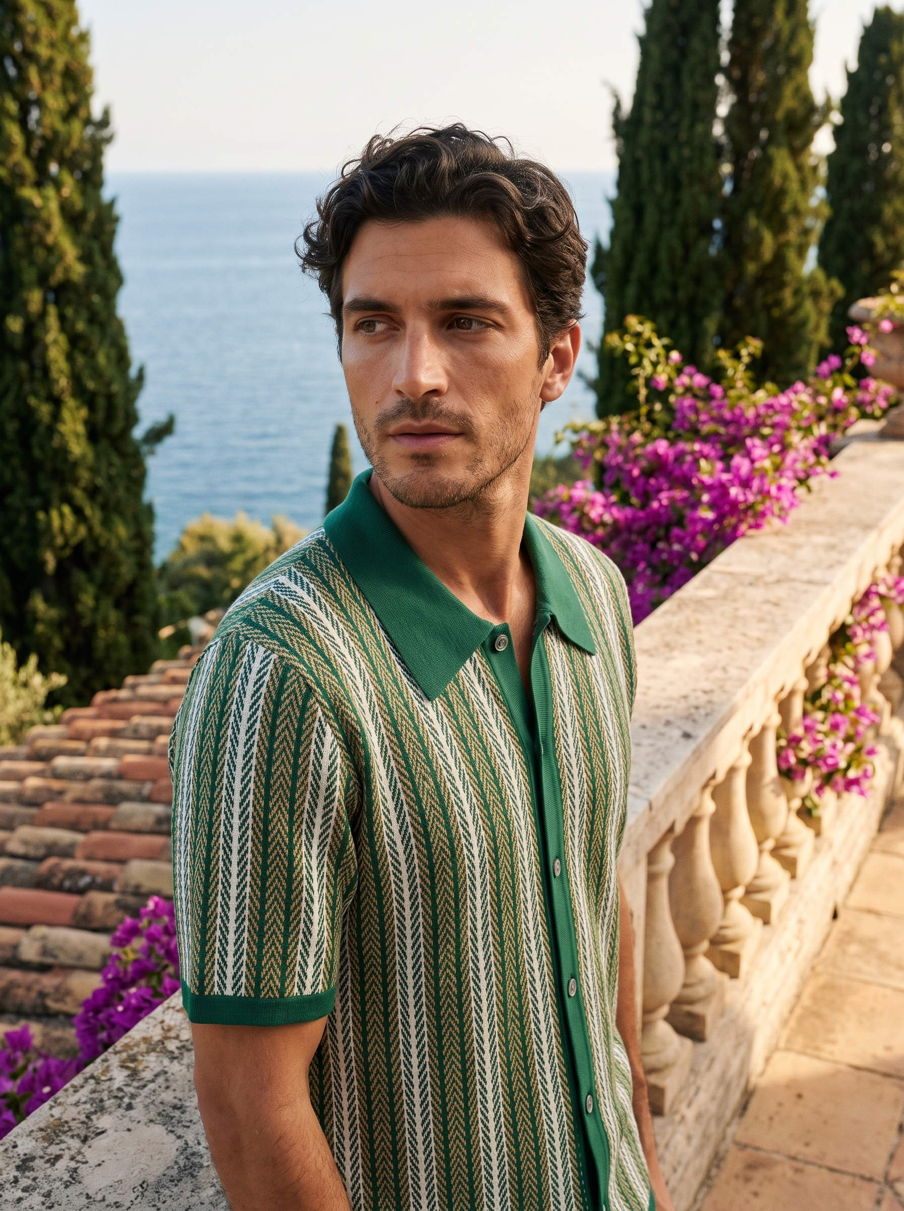 Man wearing a green striped knit button polo on a balcony overlooking Lake Como, old money style — Aveloire