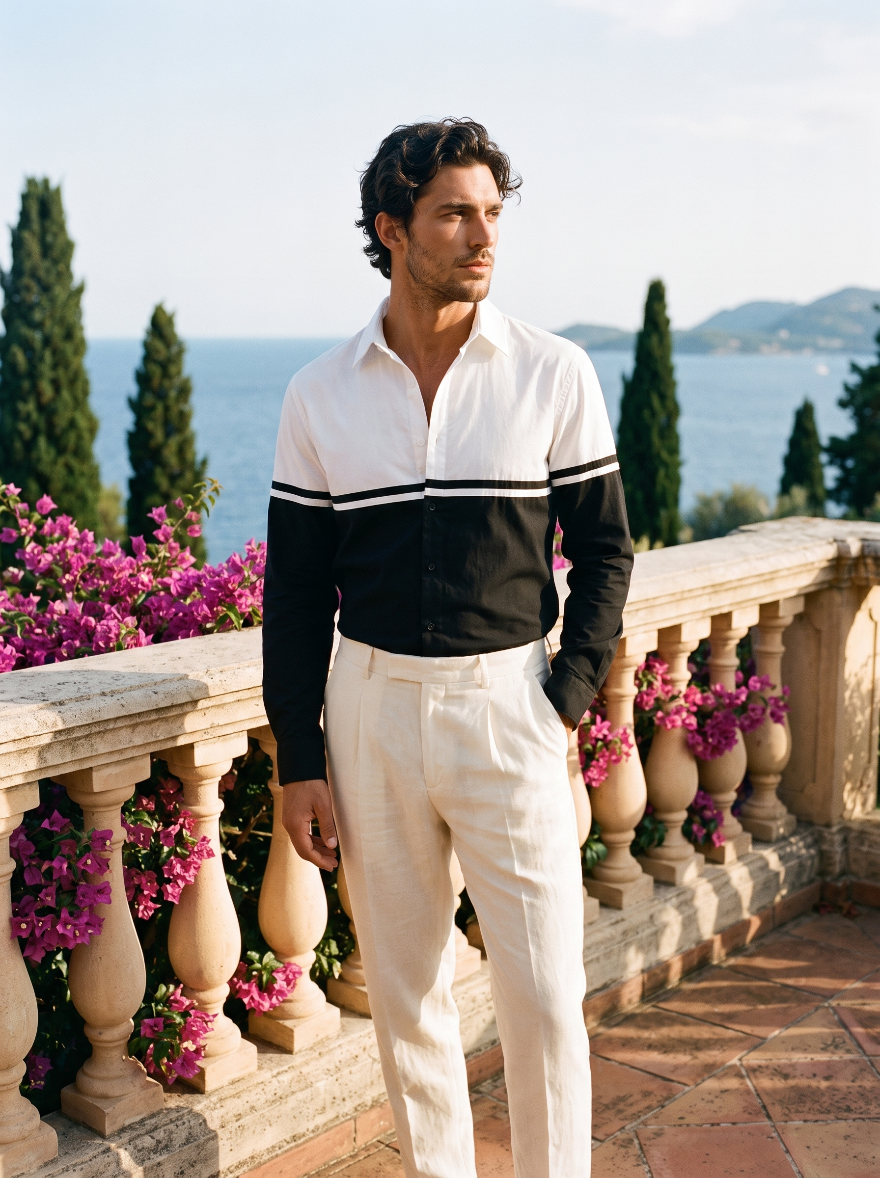 Full-length shot of a man in a black and white colour-block long sleeve shirt at Lake Como — Aveloire