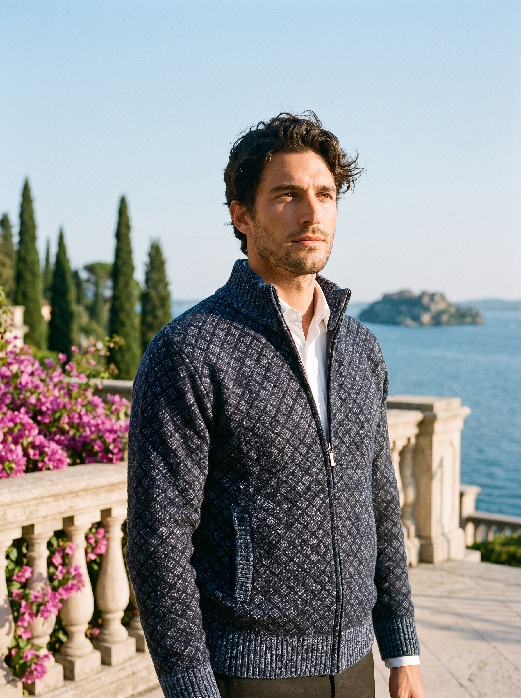 Man wearing a navy full-zip stand collar cardigan on a terrace overlooking Lake Como, old money style — Aveloire