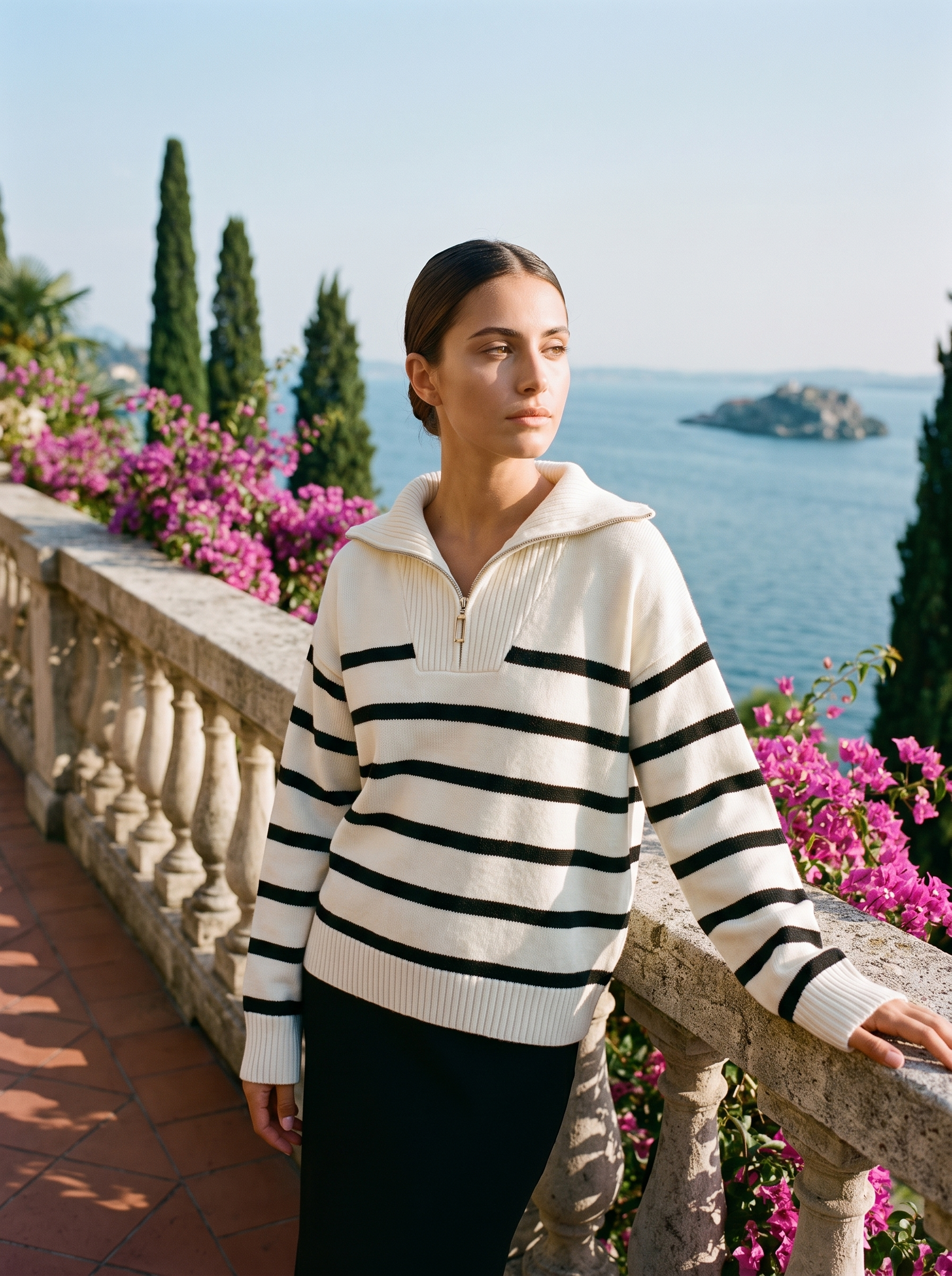 Woman wearing a cream and black striped quarter-zip polo sweater on a Lake Como terrace, old money style — Aveloire