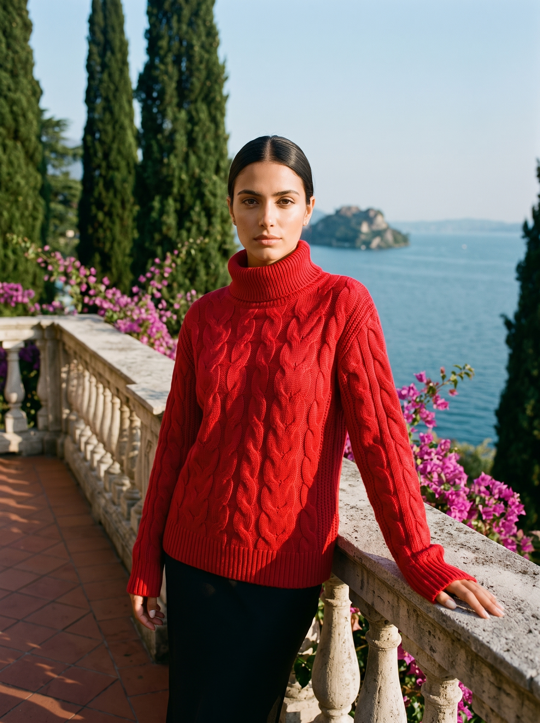 Woman wearing a red cable-knit turtleneck sweater on a Lake Como terrace — Aveloire
