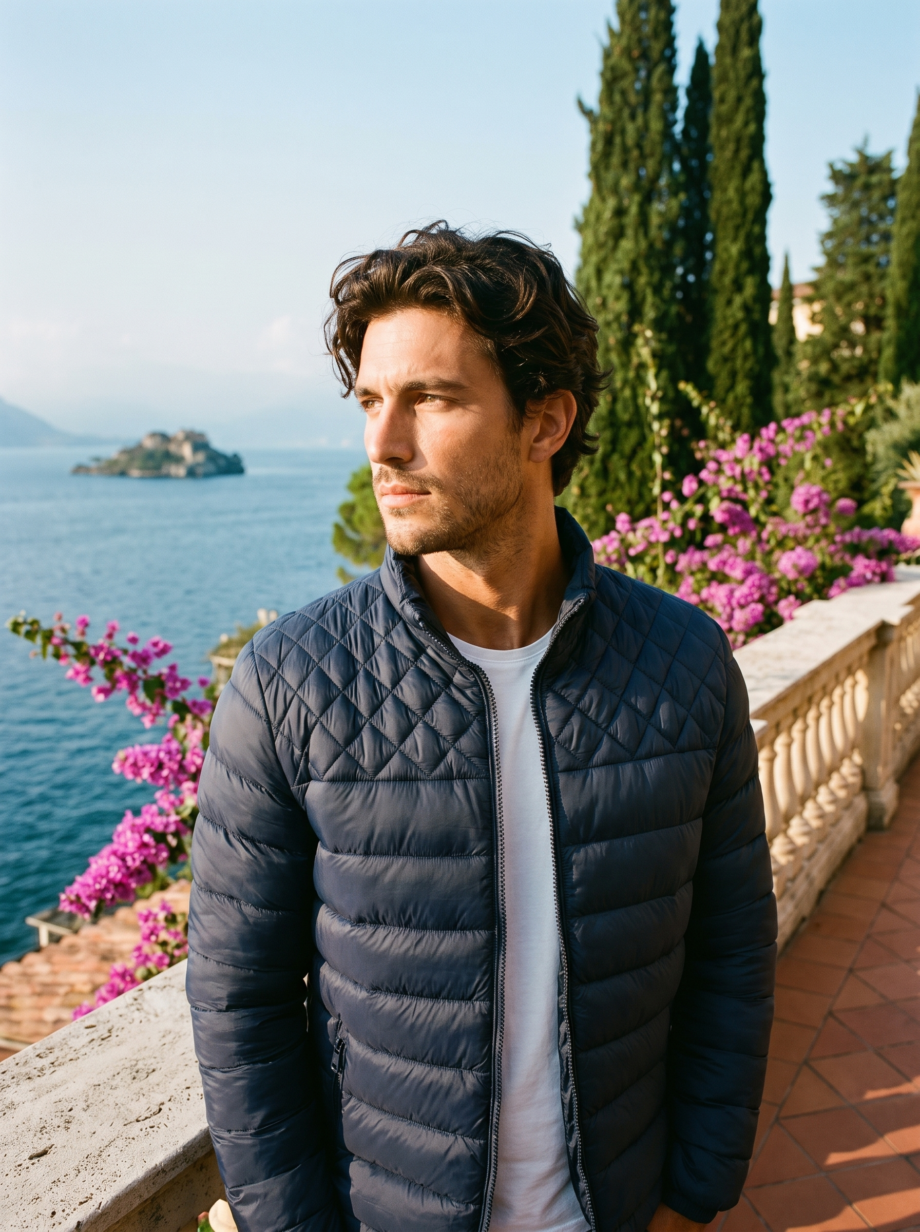 Man wearing dark blue stand collar puffer jacket on a Lake Como terrace — Aveloire