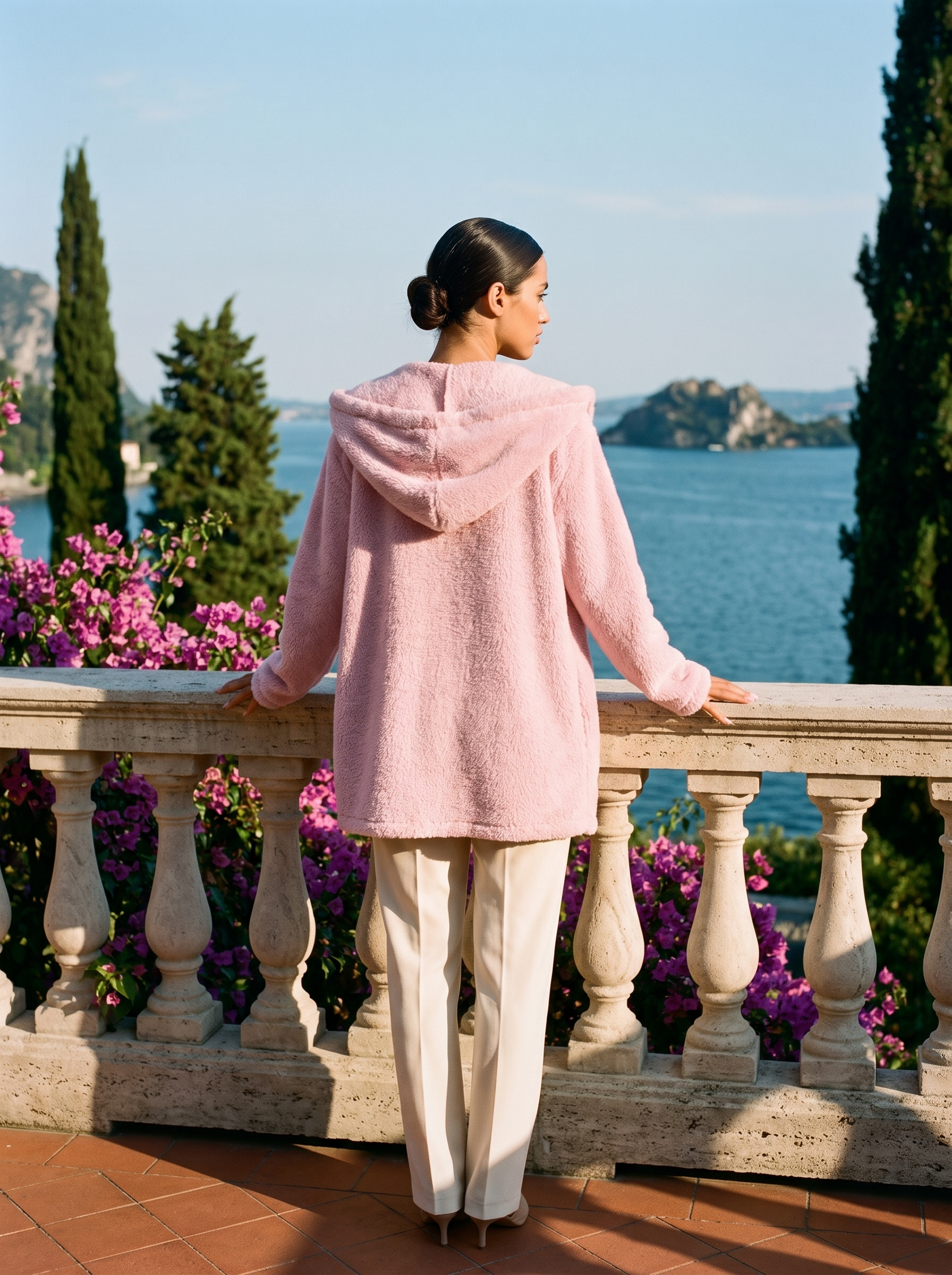 Pink hooded cardigan, full body back view on a Lake Como terrace — Aveloire