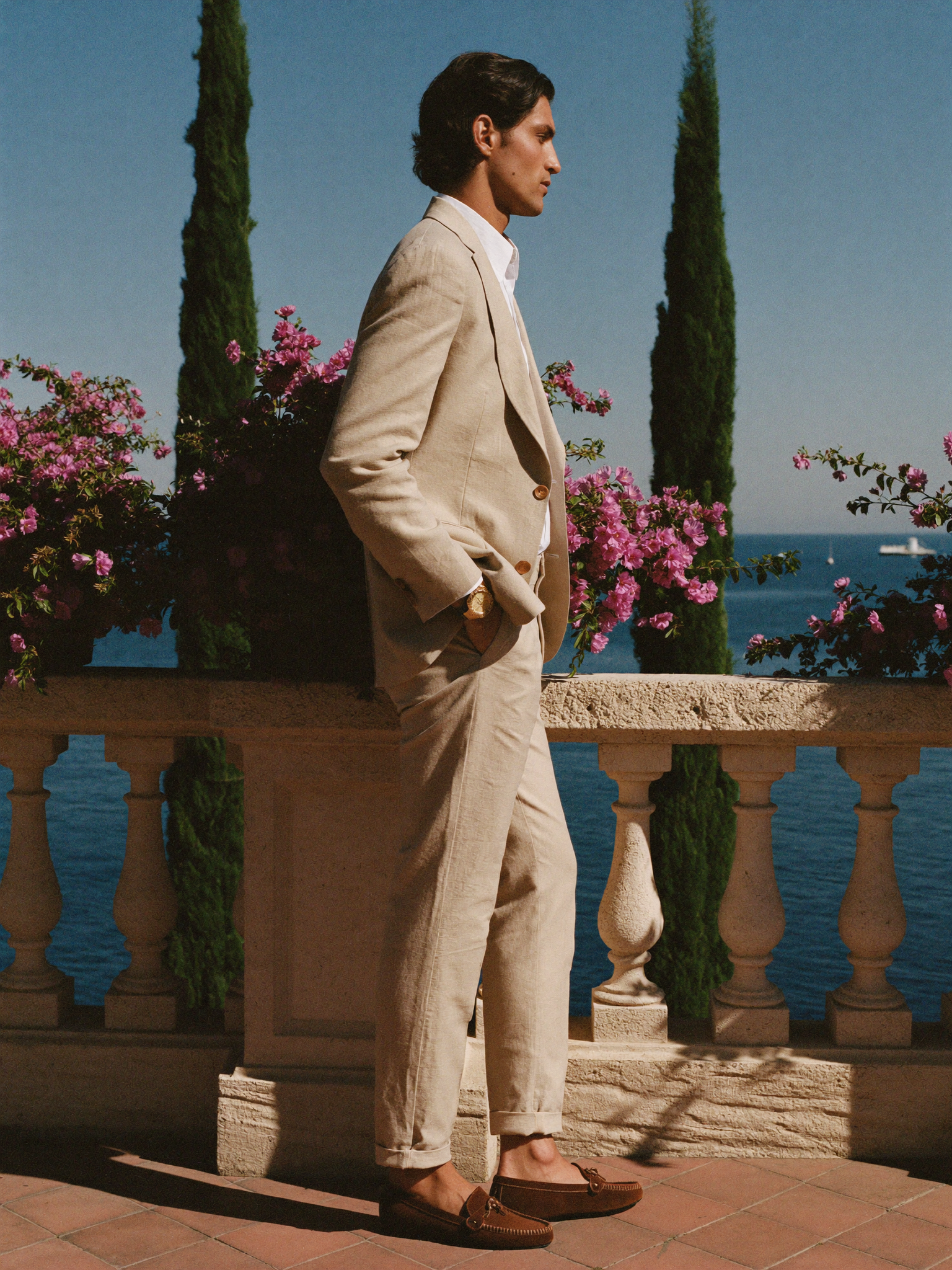 Men's Aveloire Valmont slim-fit linen suit in beige — side profile showing the tailored silhouette