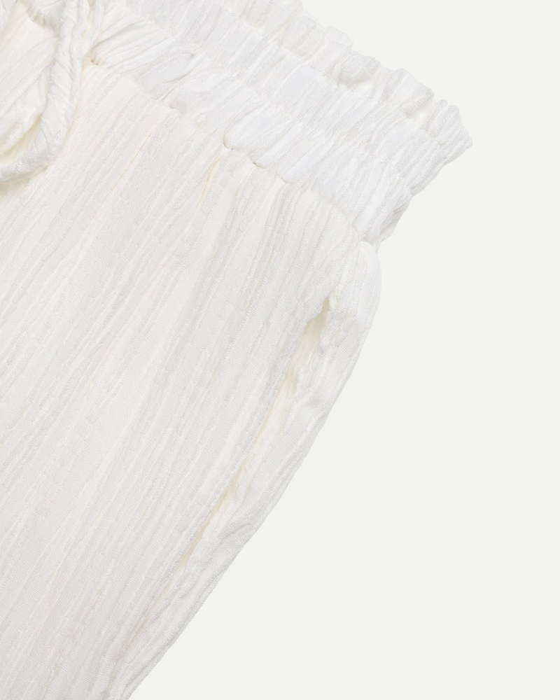 white wide leg trousers high waist drawstring lightweight fabric close up