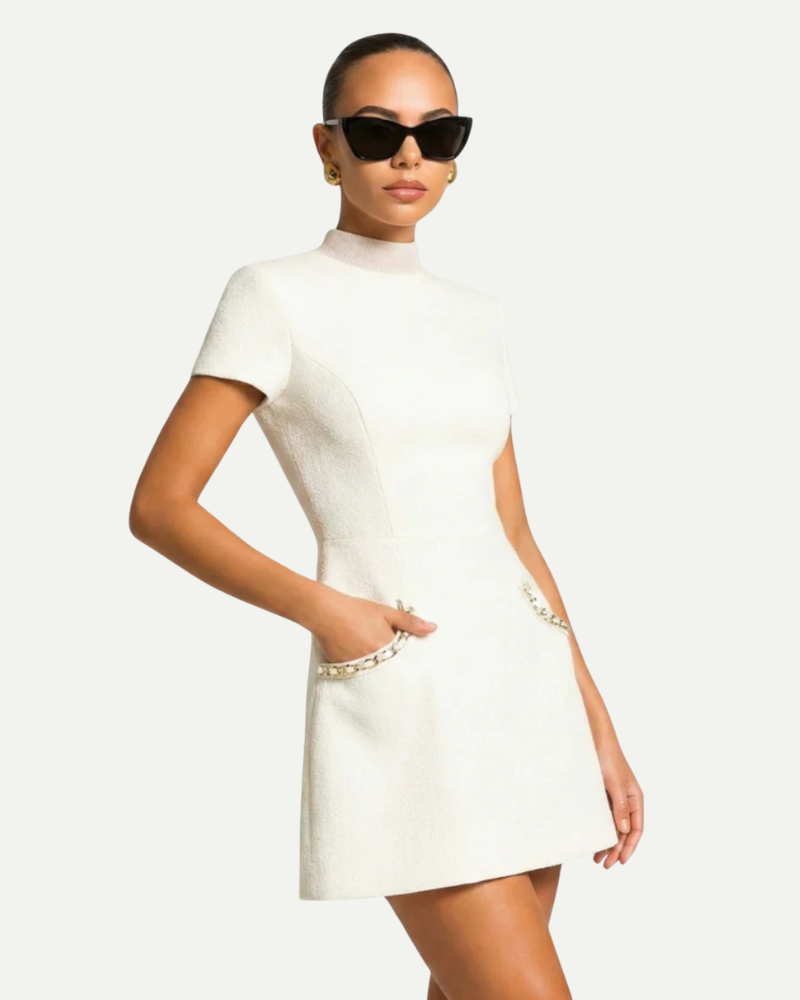 Female model wearing white tweed mini dress embellished trim short sleeve outfit
