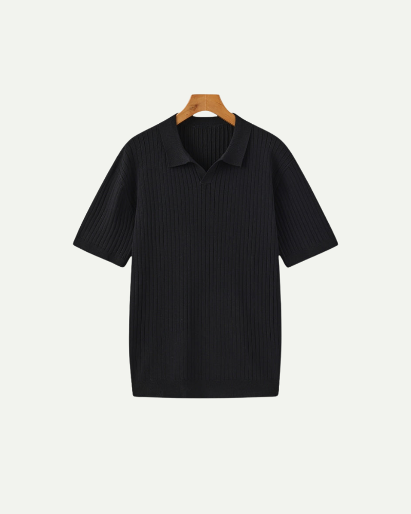 Black ribbed polo shirt on a wooden hanger against a white background