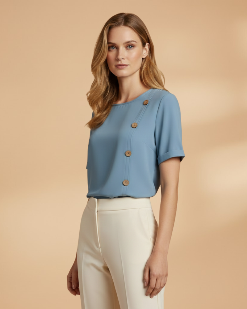 female model wearing light blue loose blouse standing pose Lubomirske
