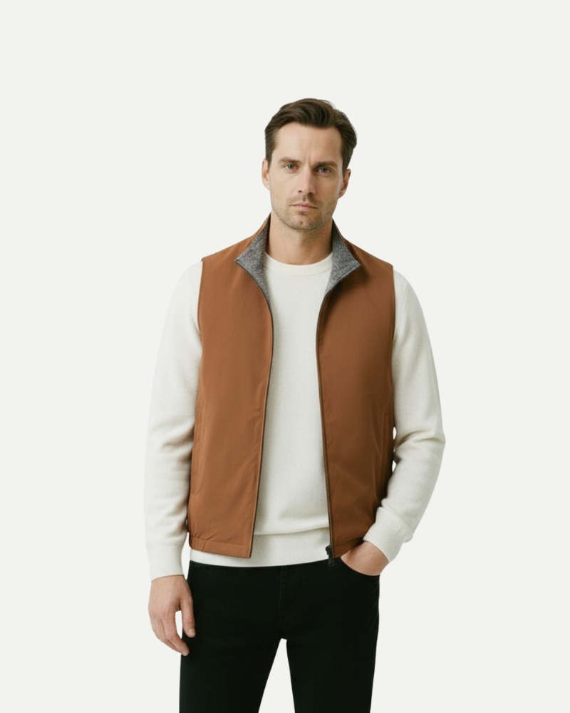 Male model wearing a brown reversible zip-up vest with stand collar and slim fit
