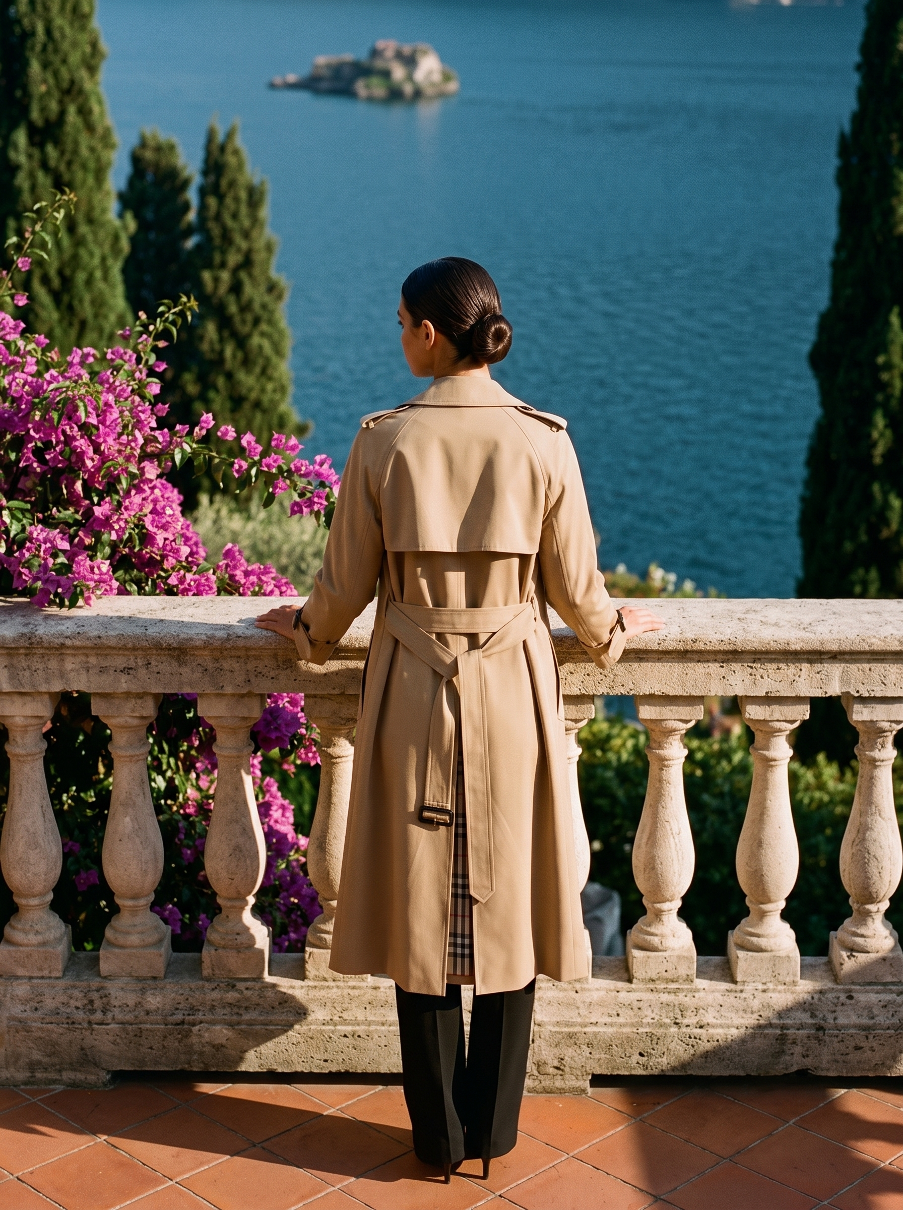 Back view of a beige belted trench coat on a Lake Como terrace — Aveloire