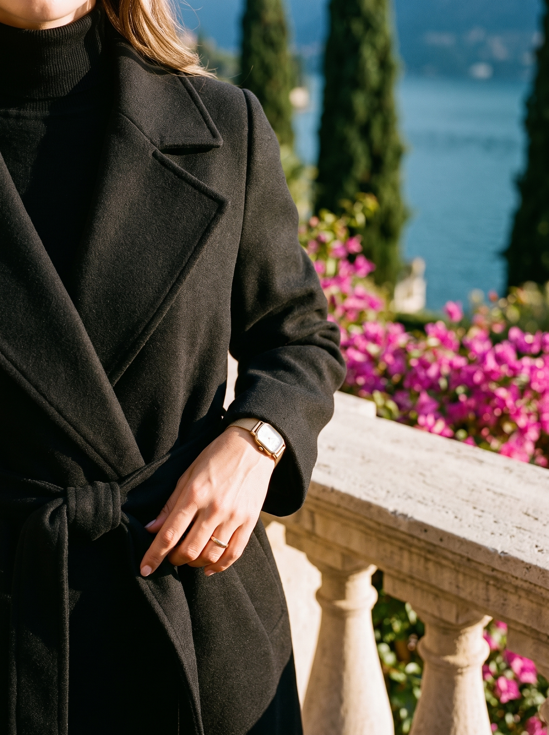 Black longline winter trench coat collar belt detail — Aveloire