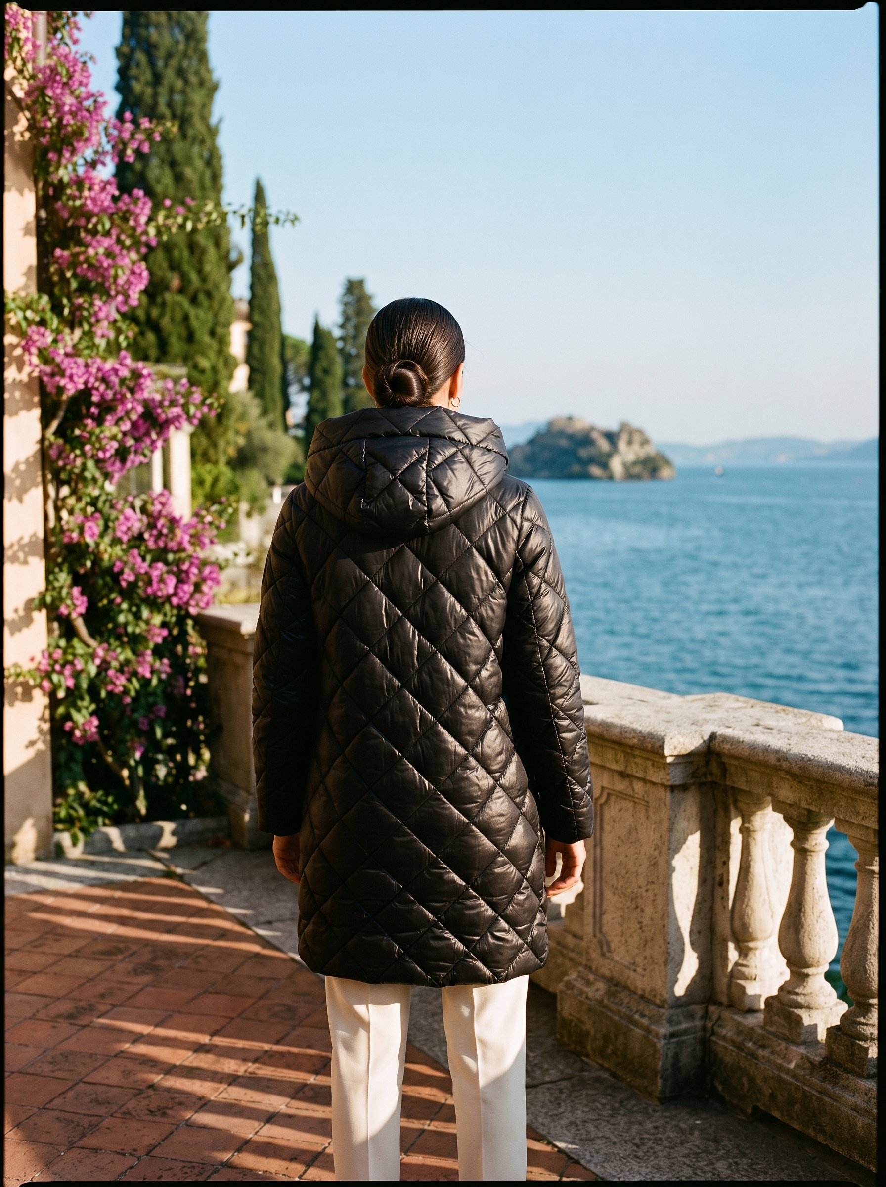 Black quilted coat full body back view — Aveloire