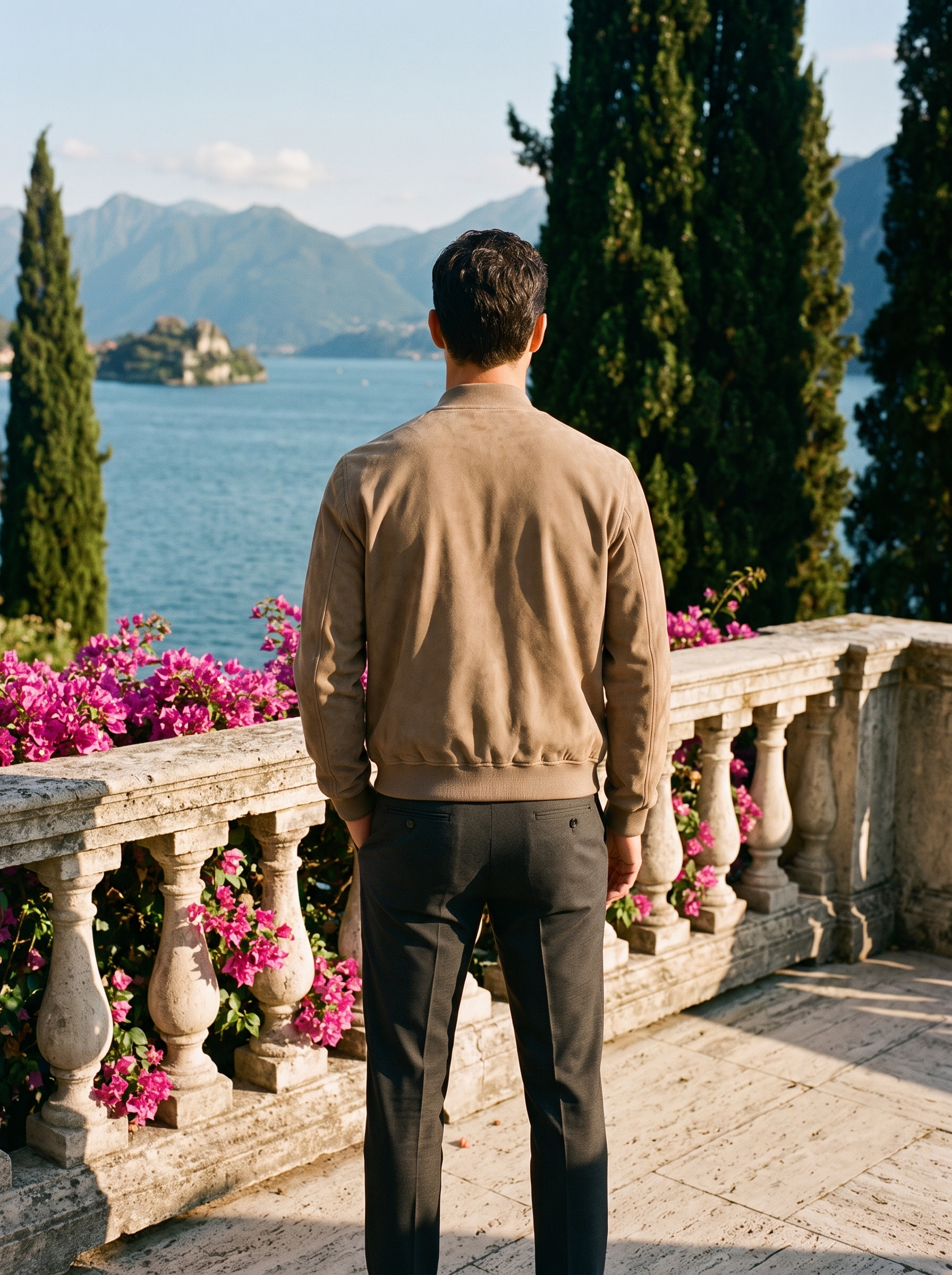 Man wearing a camel suede bomber jacket, full-length back view on a Lake Como terrace, old money style — Aveloire