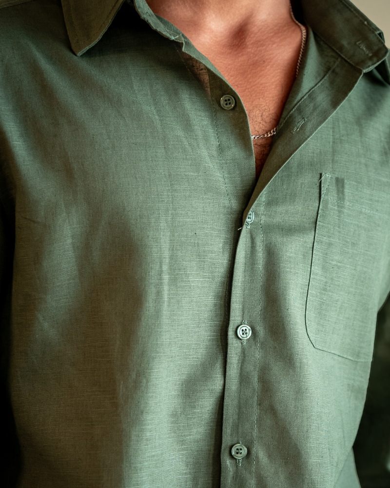 Green linen shirt men button up chest detail breathable summer fabric close up