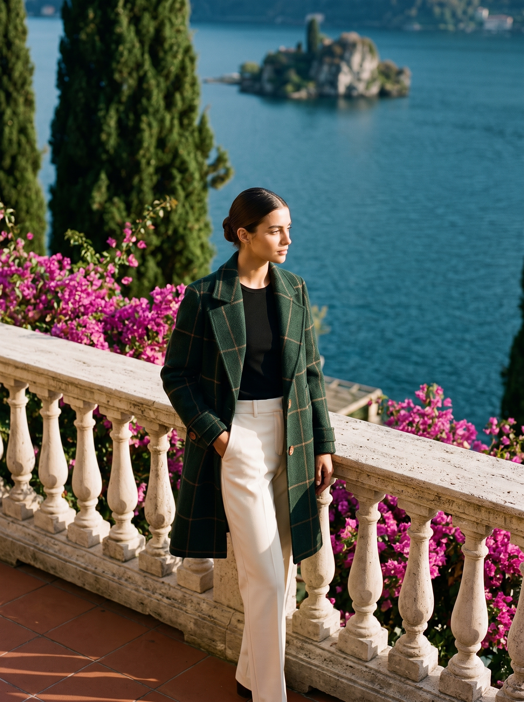 Full-length front view of a green windowpane-check wool coat on a Lake Como terrace — Aveloire