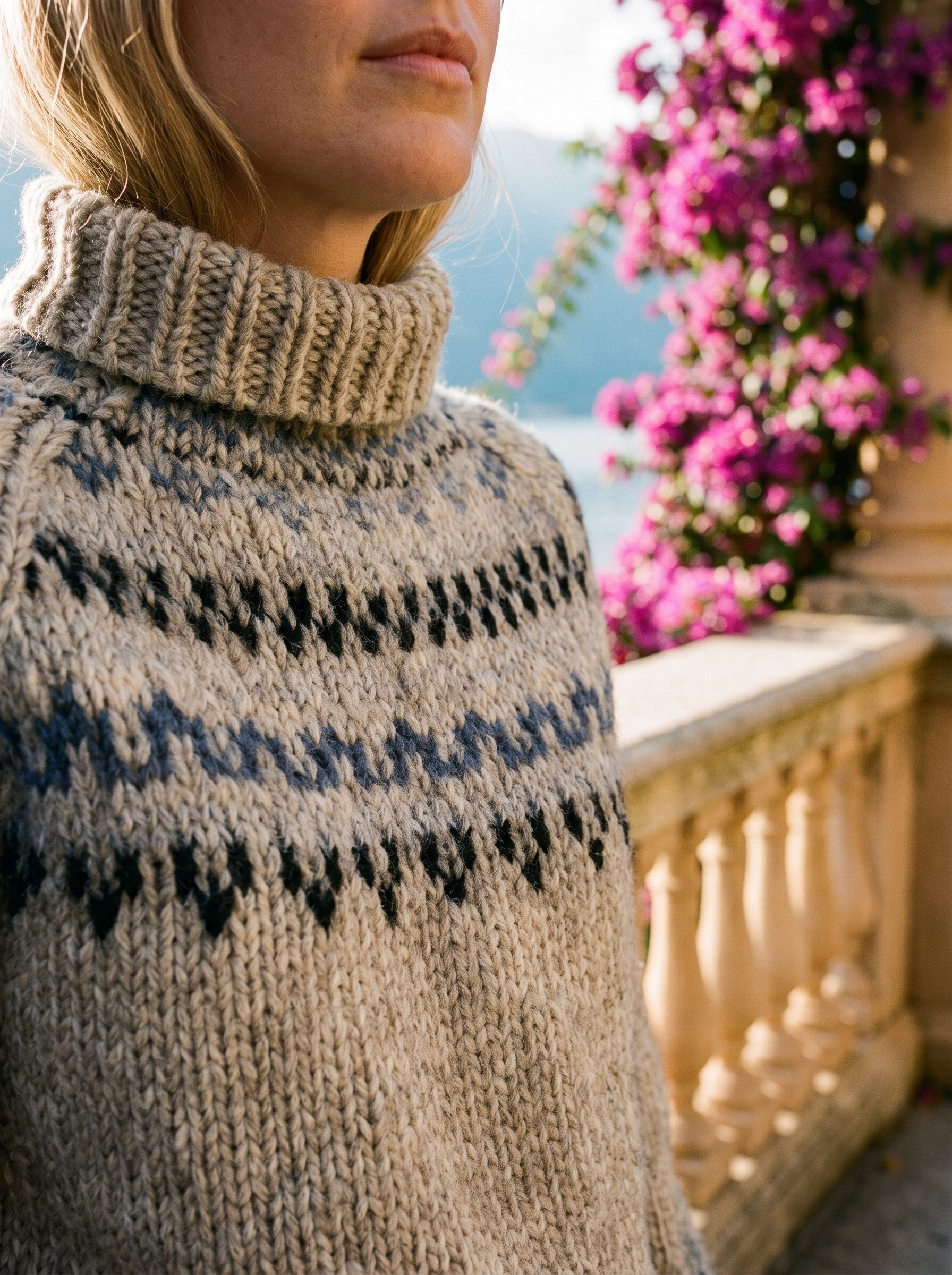 Close-up of the Fair Isle yoke pattern and chunky knit of a grey roll-neck jumper — Aveloire