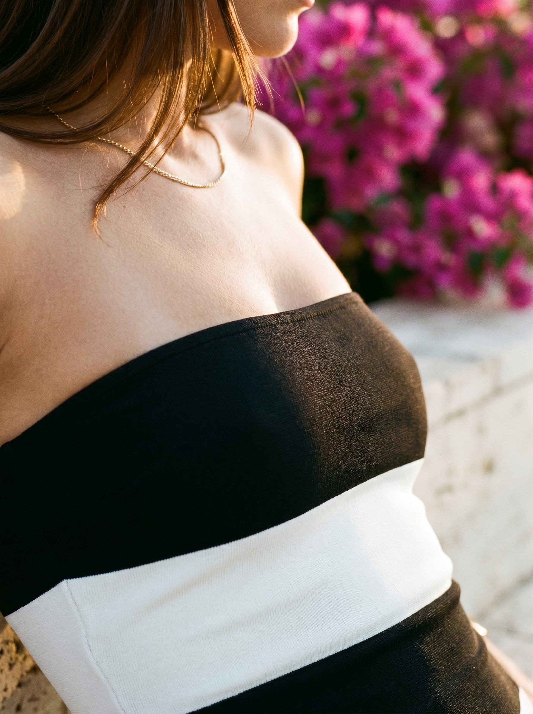 Detail of strapless bandeau edge and horizontal stripe pattern — Aveloire