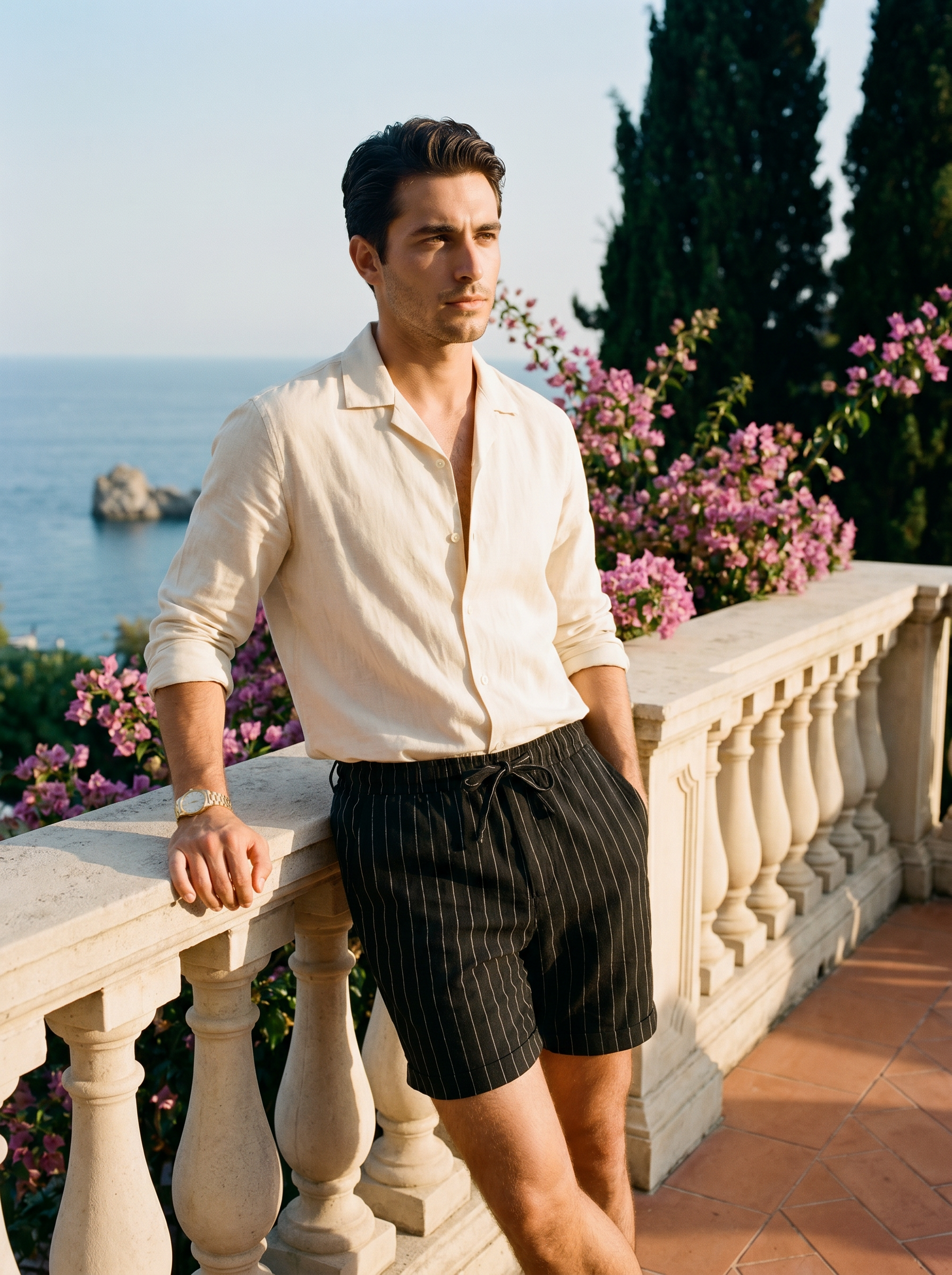 Amber by Aveloire — Men's black pinstripe linen shorts, hero portrait, Italian Riviera editorial