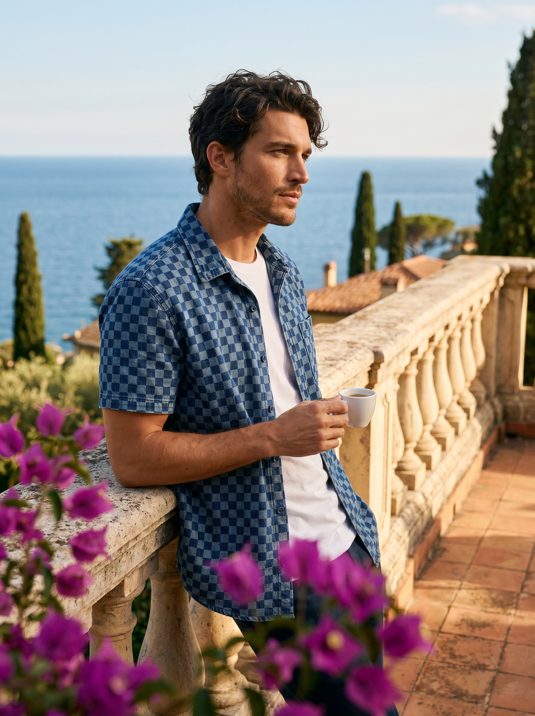 Man in a navy checkerboard denim shirt with an espresso on a Lake Como terrace, old money lifestyle — Aveloire