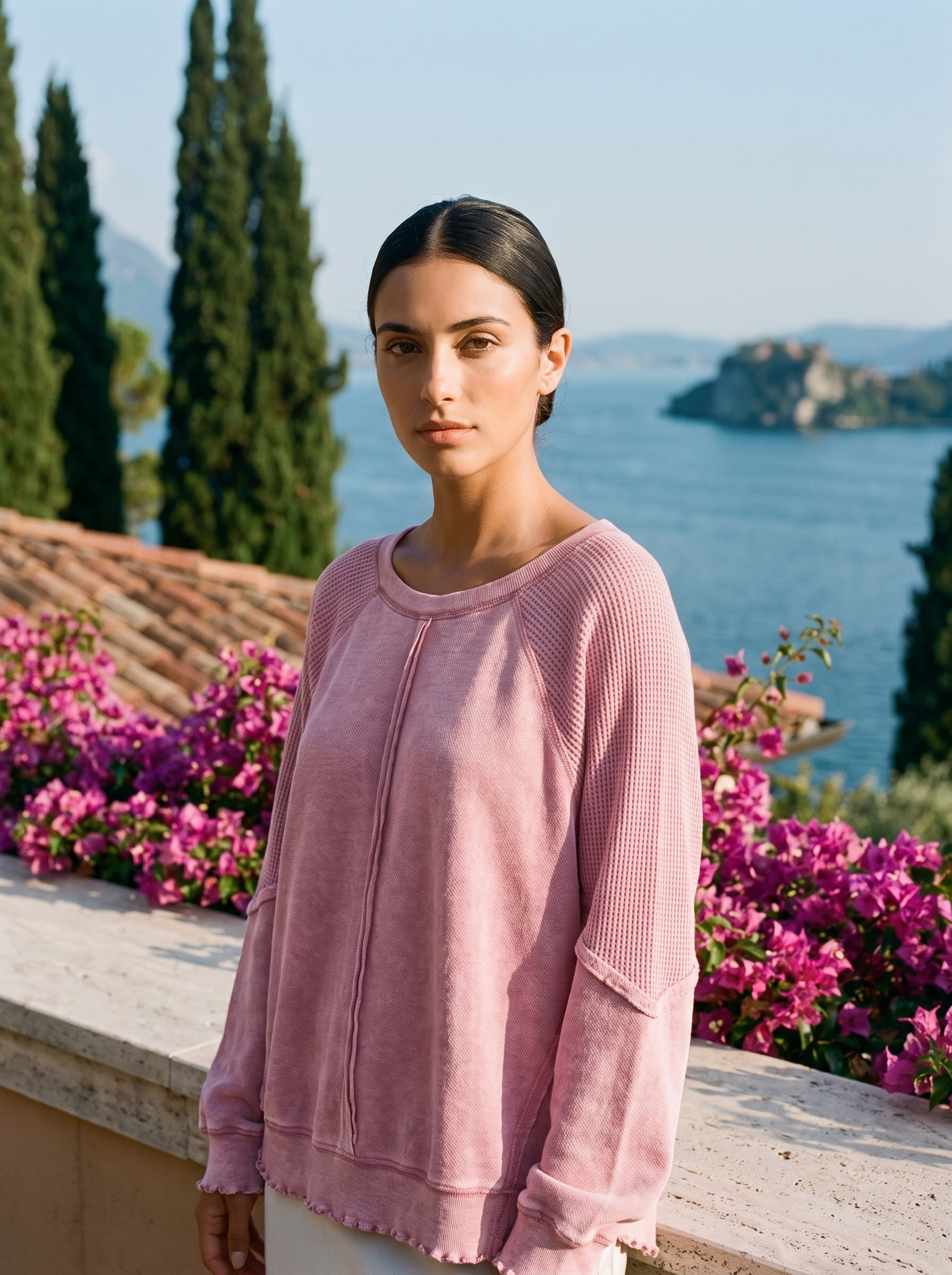 Woman wearing a dusty pink waffle-panel top on a Lake Como terrace — Aveloire