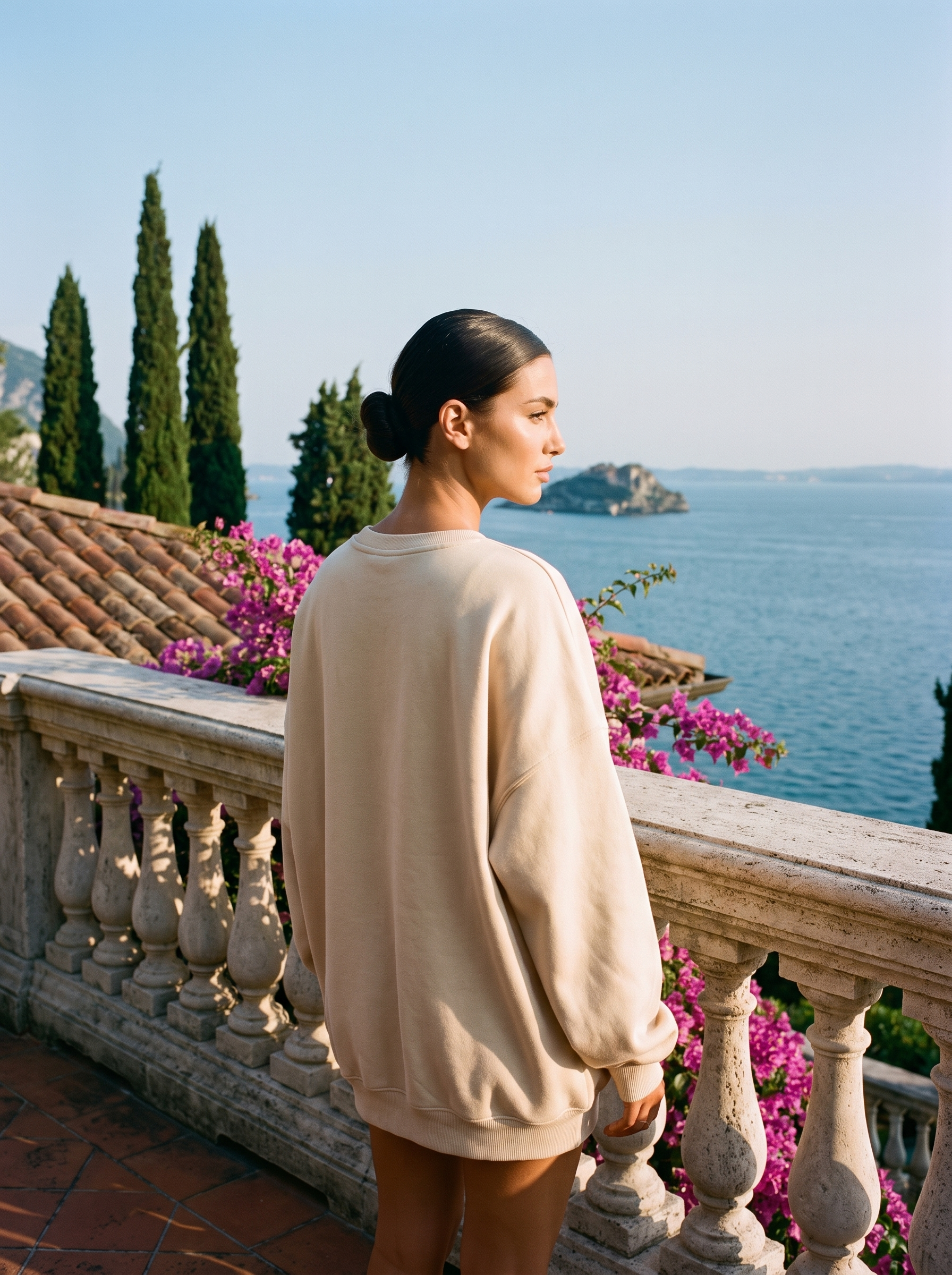 Back view of a cream beige oversized crew neck sweatshirt on a Lake Como terrace, old money style — Aveloire