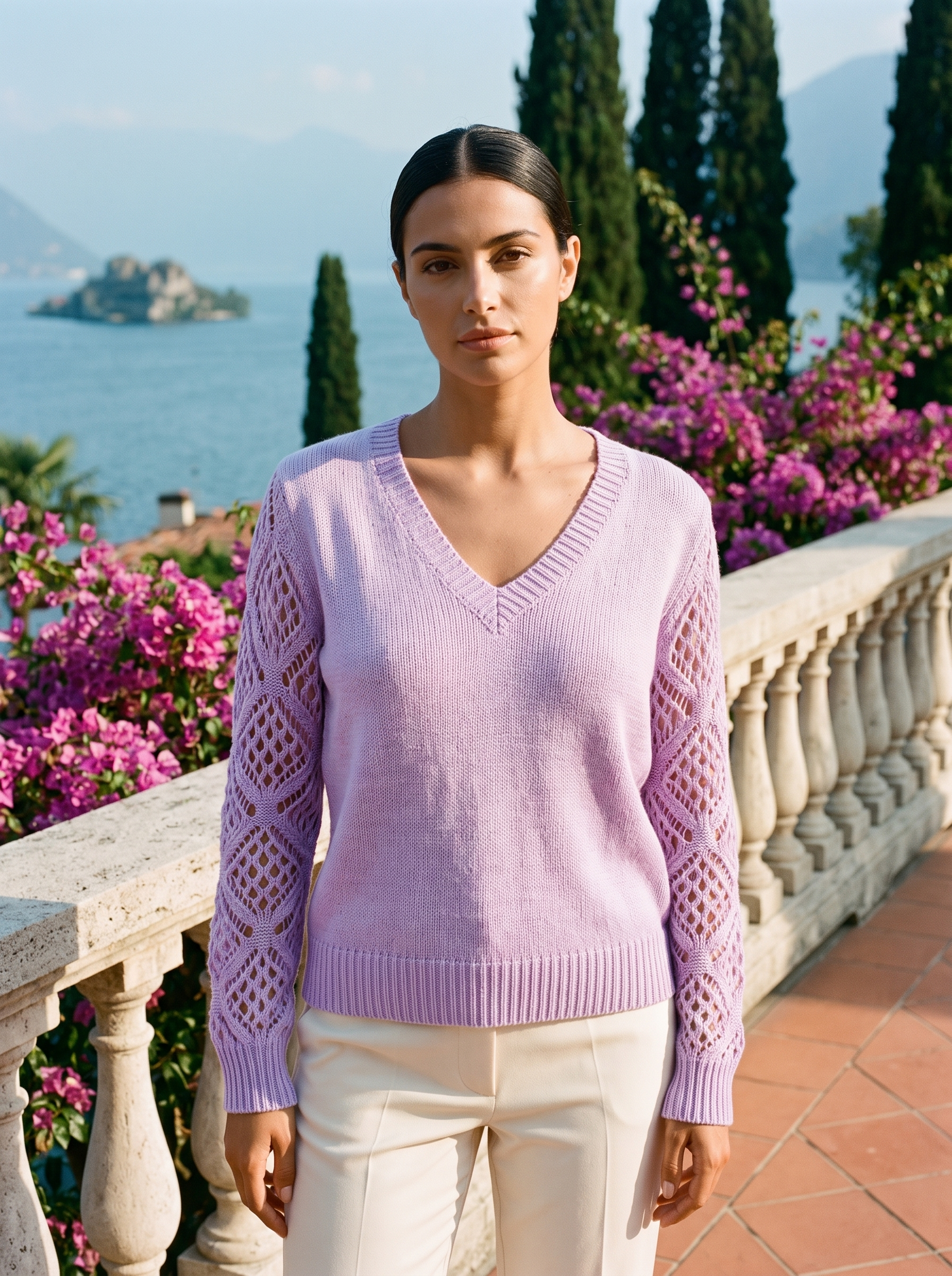 Woman wearing a lavender V-neck knit jumper on a Lake Como terrace, old money style — Aveloire