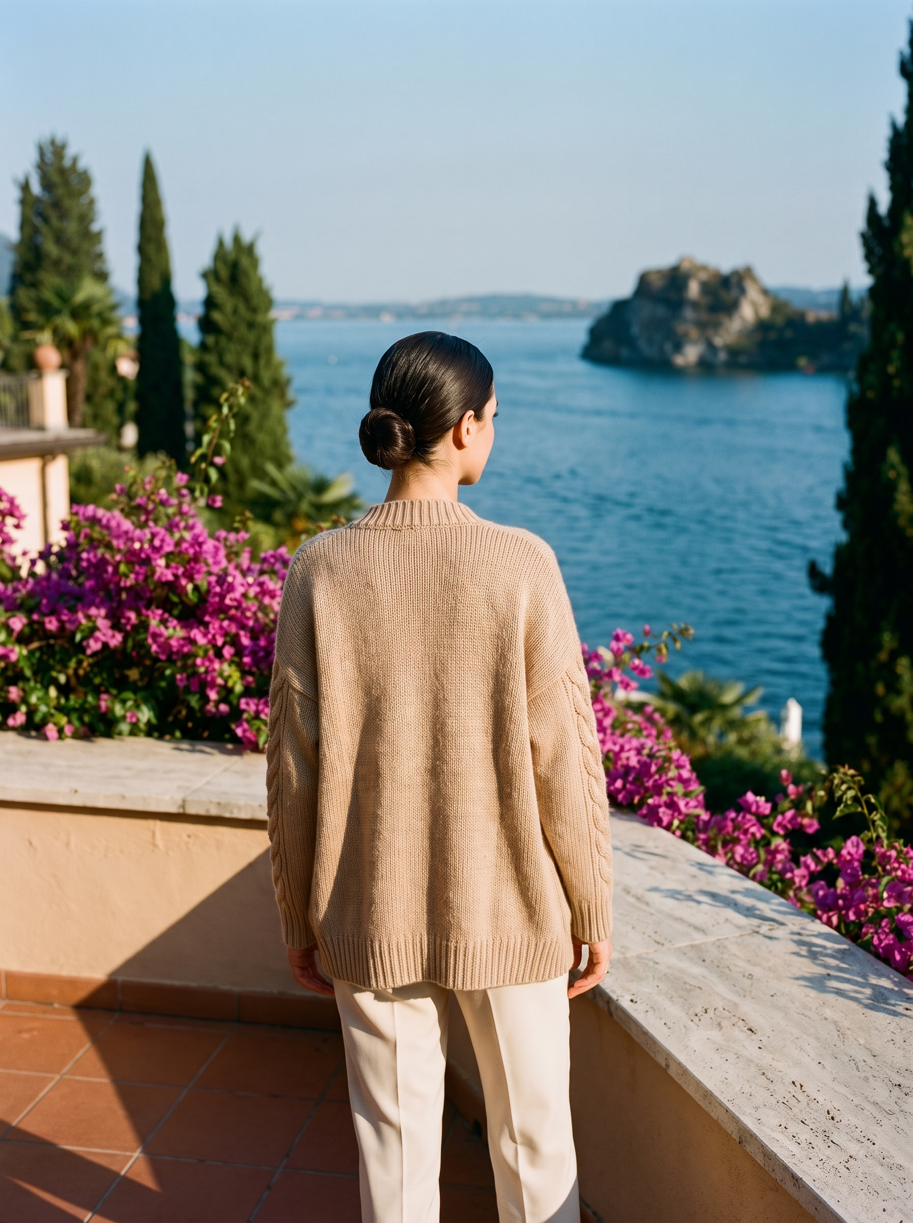 Khaki open-front cardigan, full body back view on a Lake Como terrace — Aveloire