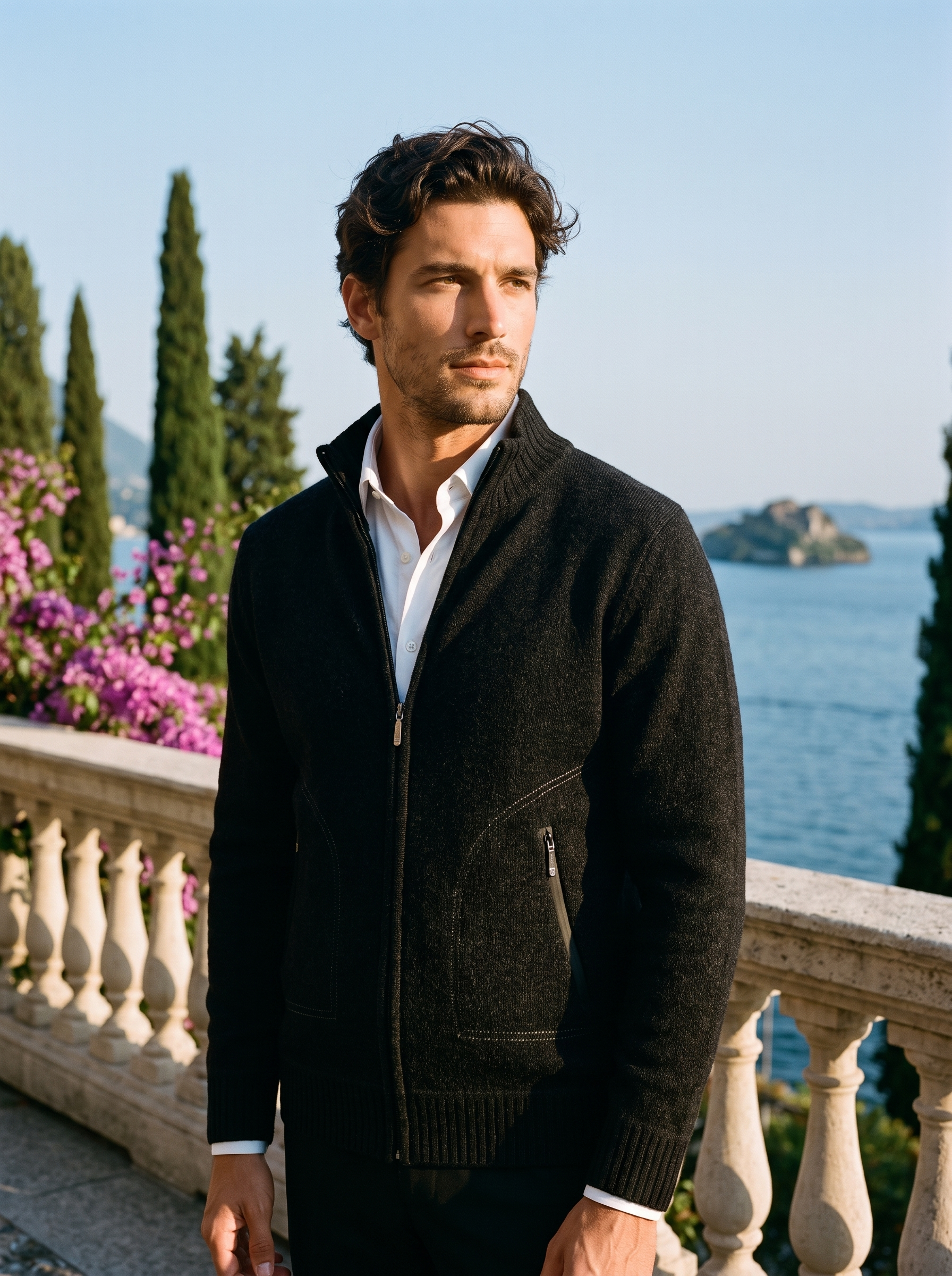 Man wearing a black melange zip-up stand collar cardigan on a terrace overlooking Lake Como, old money style — Aveloire