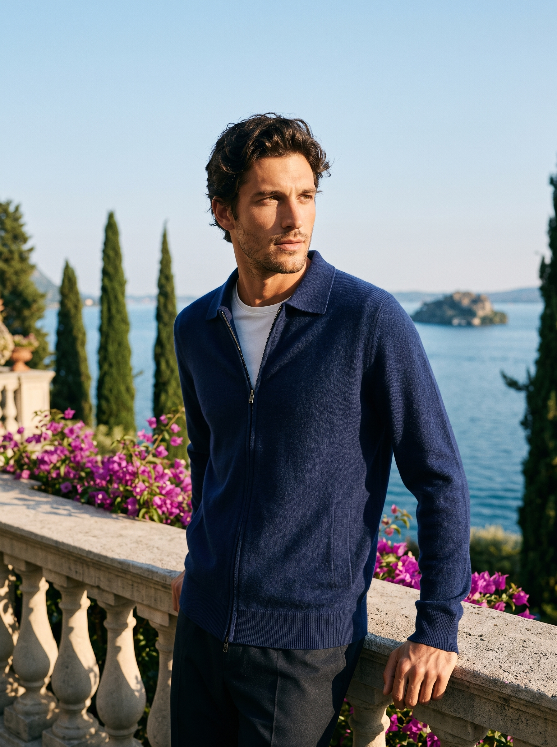 Man wearing a navy mercerized wool zip-up collared cardigan on a terrace overlooking Lake Como, old money style — Aveloire