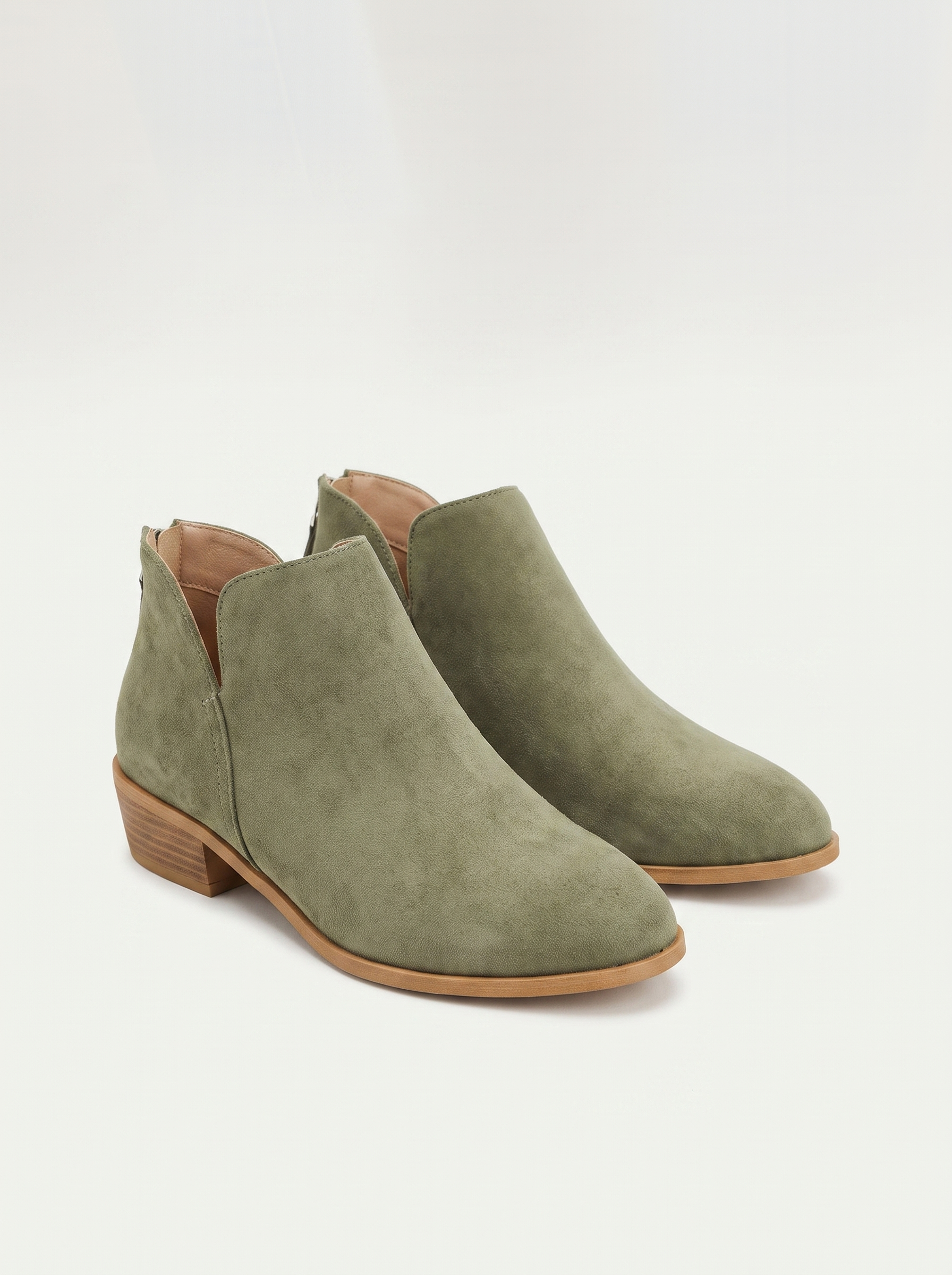 Olive suede V-cut ankle boots flat lay product photo — Beatrix by Aveloire