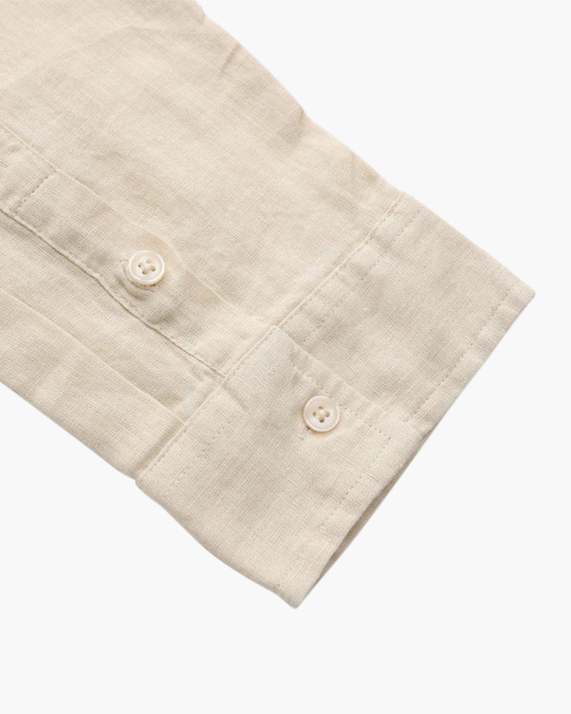 Linen shirt sleeve detail beige button cuff breathable fabric close up