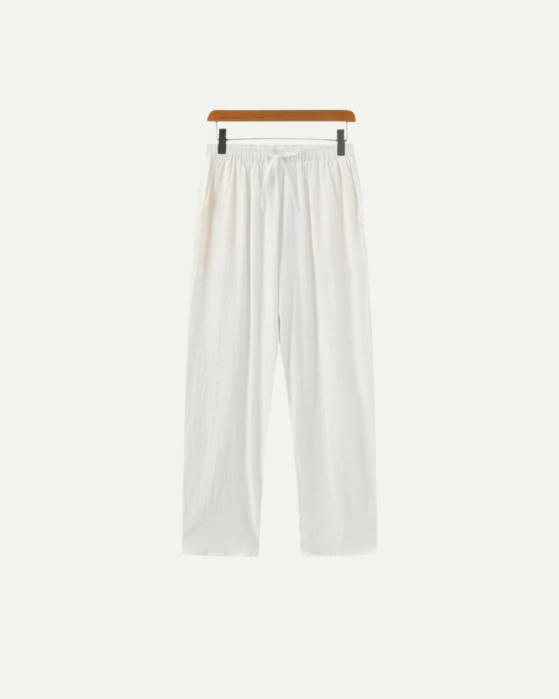 White pants on a hanger against a white background