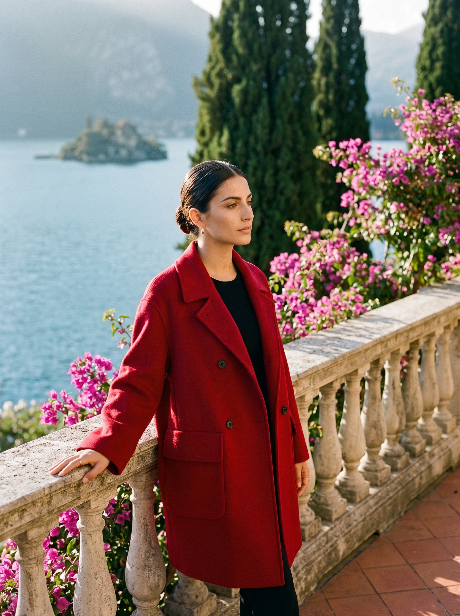 Woman wearing a red double-breasted wool coat on a Lake Como terrace — Aveloire